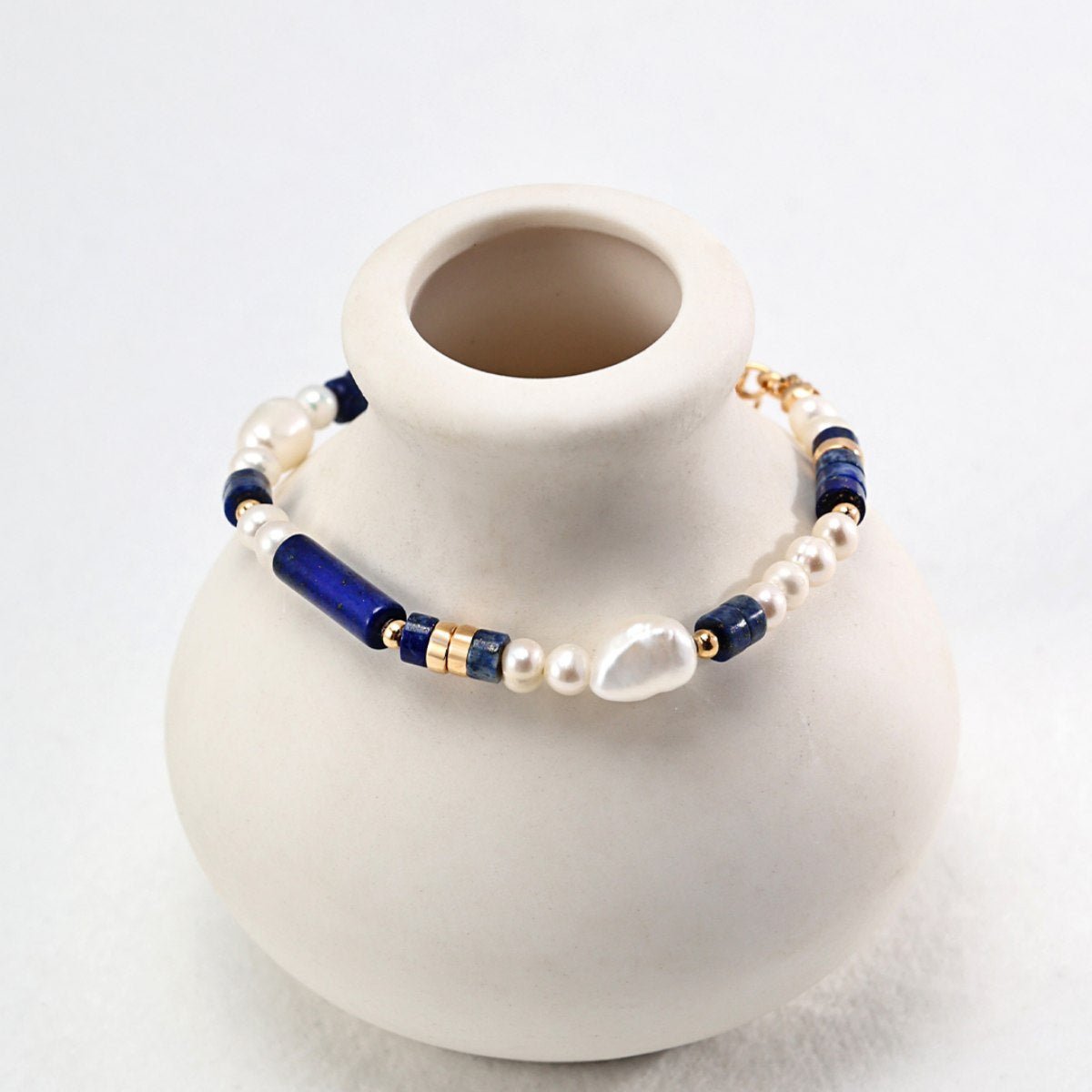 BAROQUE PEARL LAPIS LAZULI BRACELETGIFTLISTEBAROQUE PEARL LAPIS LAZULI BRACELETsterling silver, lapis lazuli, pearl, 18k gold vermeil, bracelet