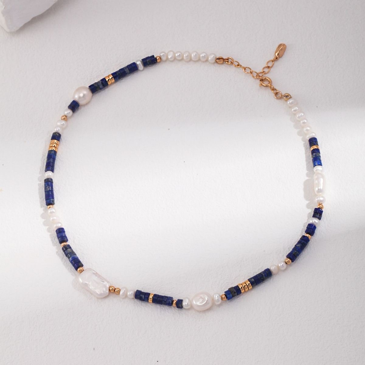 BAROQUE PEARL LAPIS LAZULI NECKLACEGIFTLISTEBAROQUE PEARL LAPIS LAZULI NECKLACEsterling silver, lapis lazuli, pearl, 18k gold vermeil, necklace