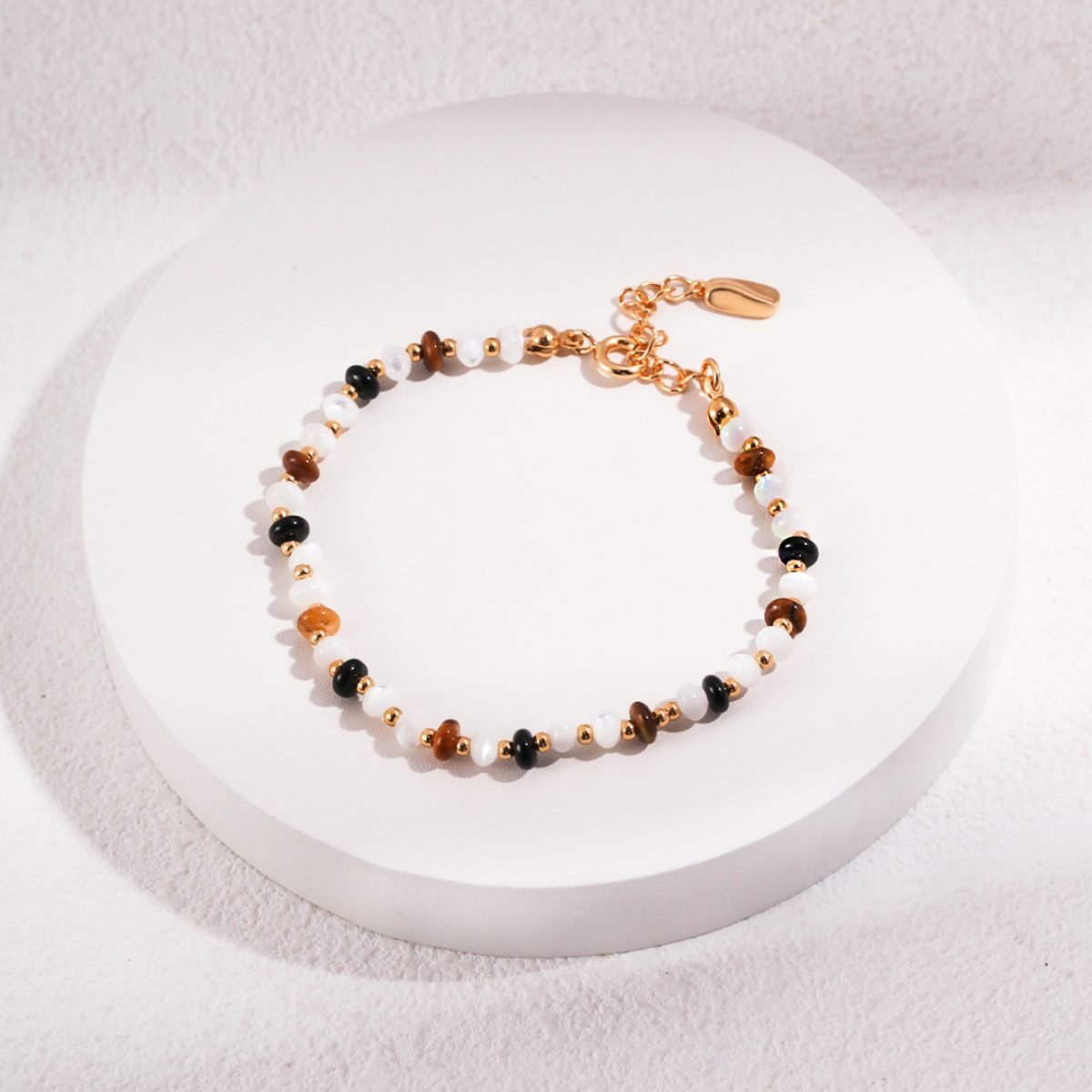 TIGER EYE AGATE BRACELETGIFTLISTETIGER EYE AGATE BRACELETbracelet, 18k gold vermeil, sterling silver, treated freshwater cultured pearl, tiger eye, black agate, silver silk shell